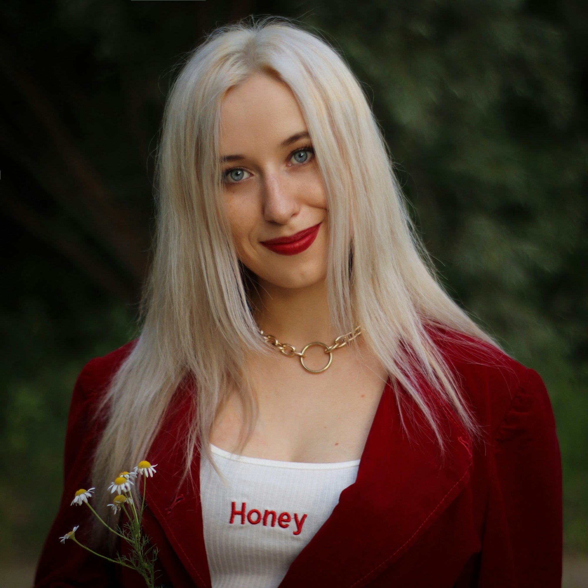 Portrait of a blonde woman in a red jacket